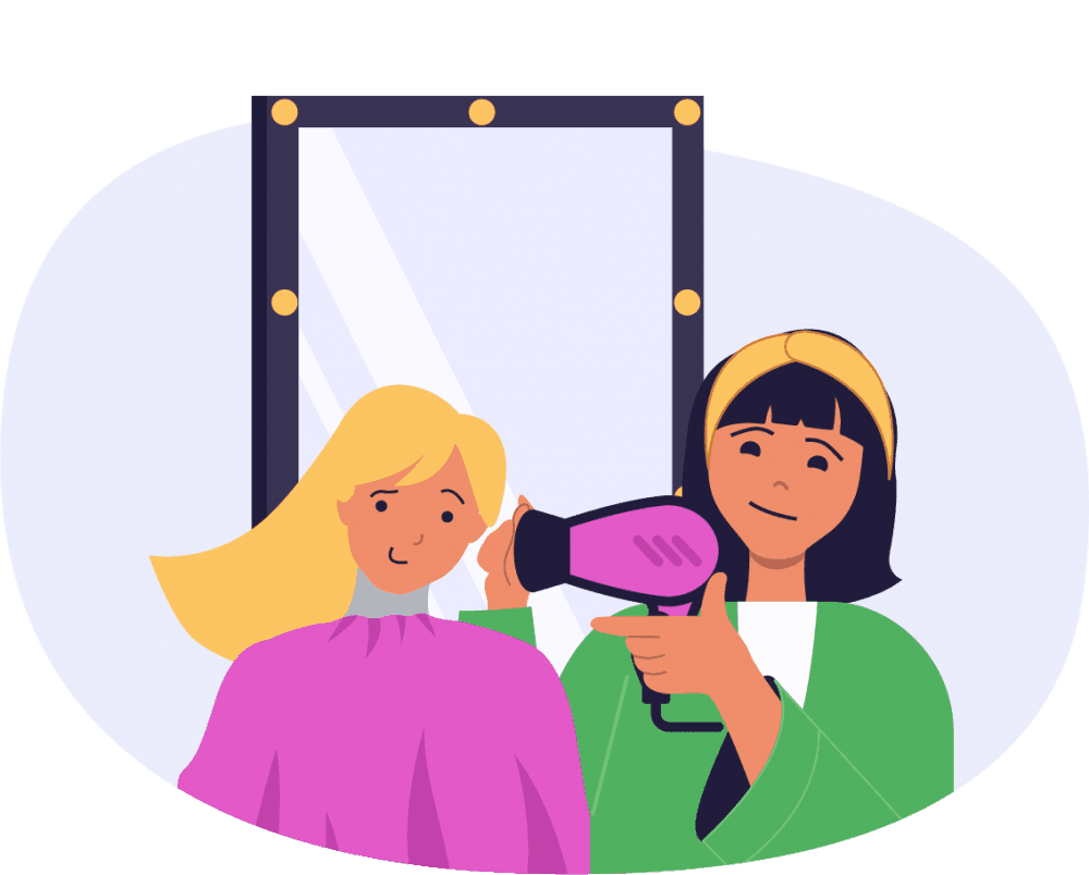 A stylist drying a client's hair in front of a salon mirror